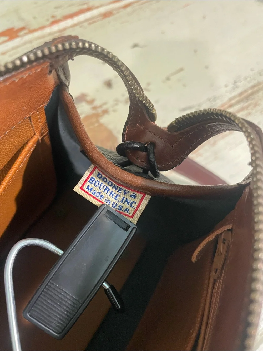 Dooney & Bourke vintage AWL Black and Brown Pebbled Leather Satchel / crossbody